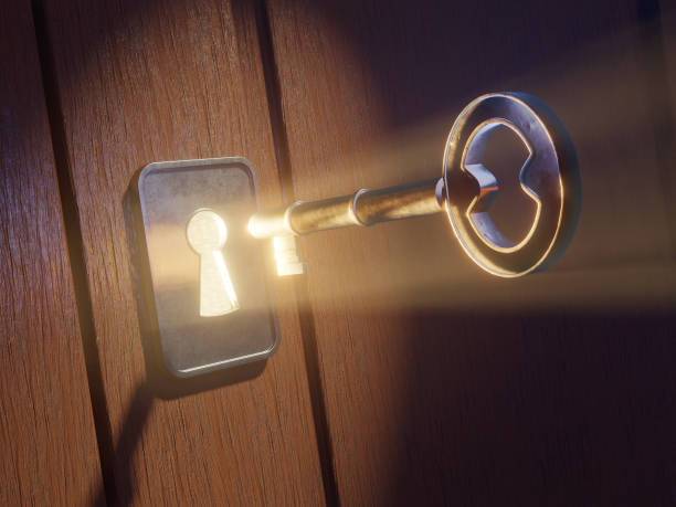 Key entering a luminous keyhole.